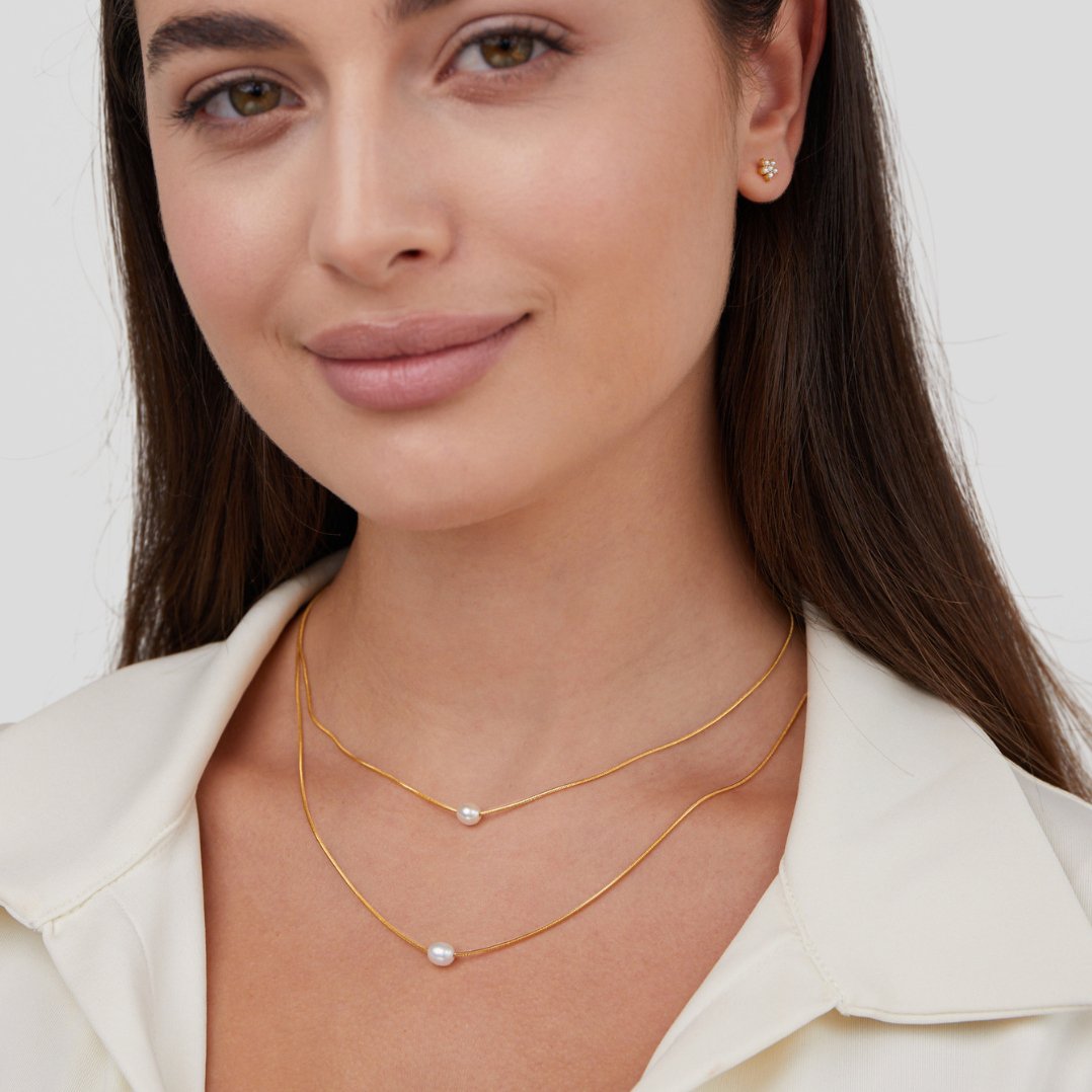 Halsband med flera lager av pärlor