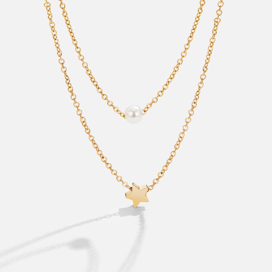 Halsband med stjärna och pärla