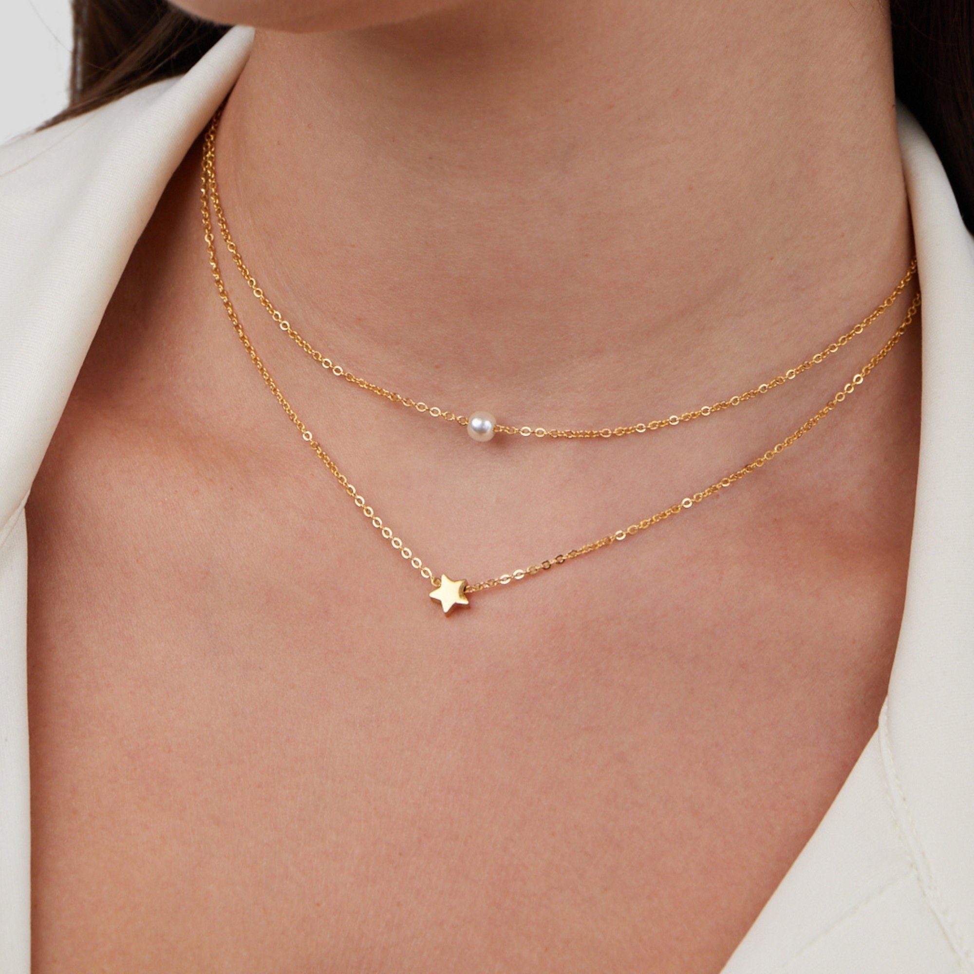 Halsband med stjärna och pärla